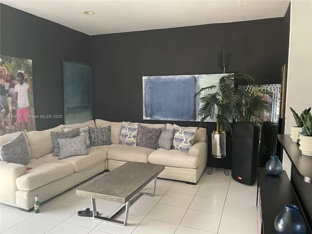 a living room with furniture and a couch