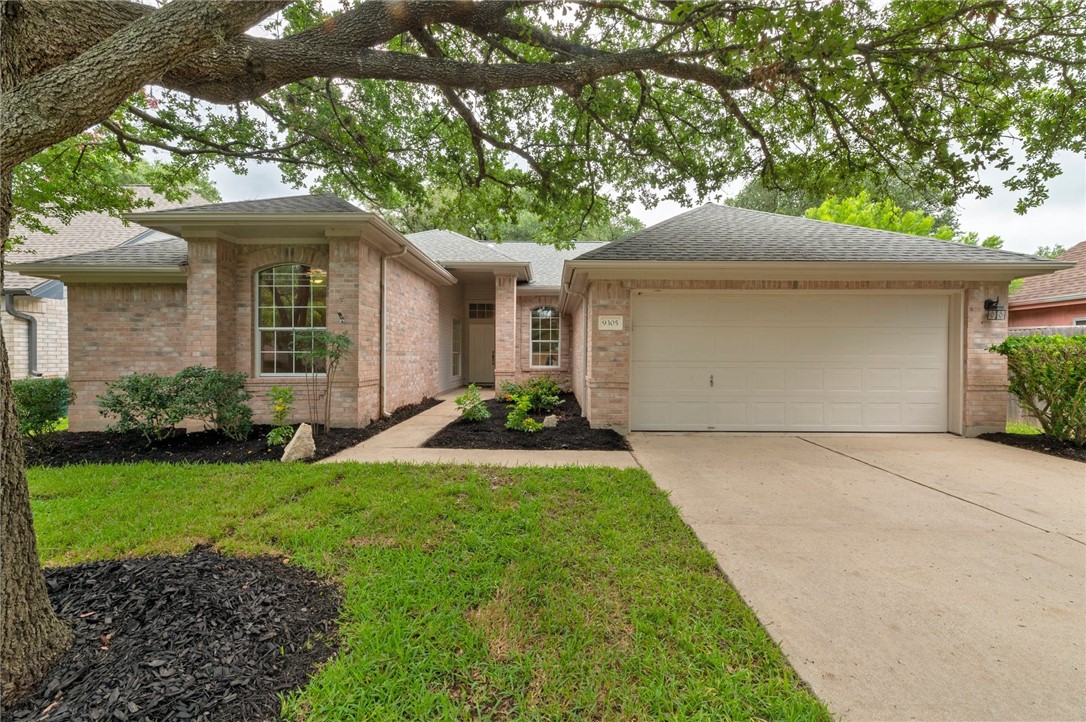 9305 Donner Lane Austin, TX 78749 - Photo 1 of 1 a front view of a house with a garden and yard