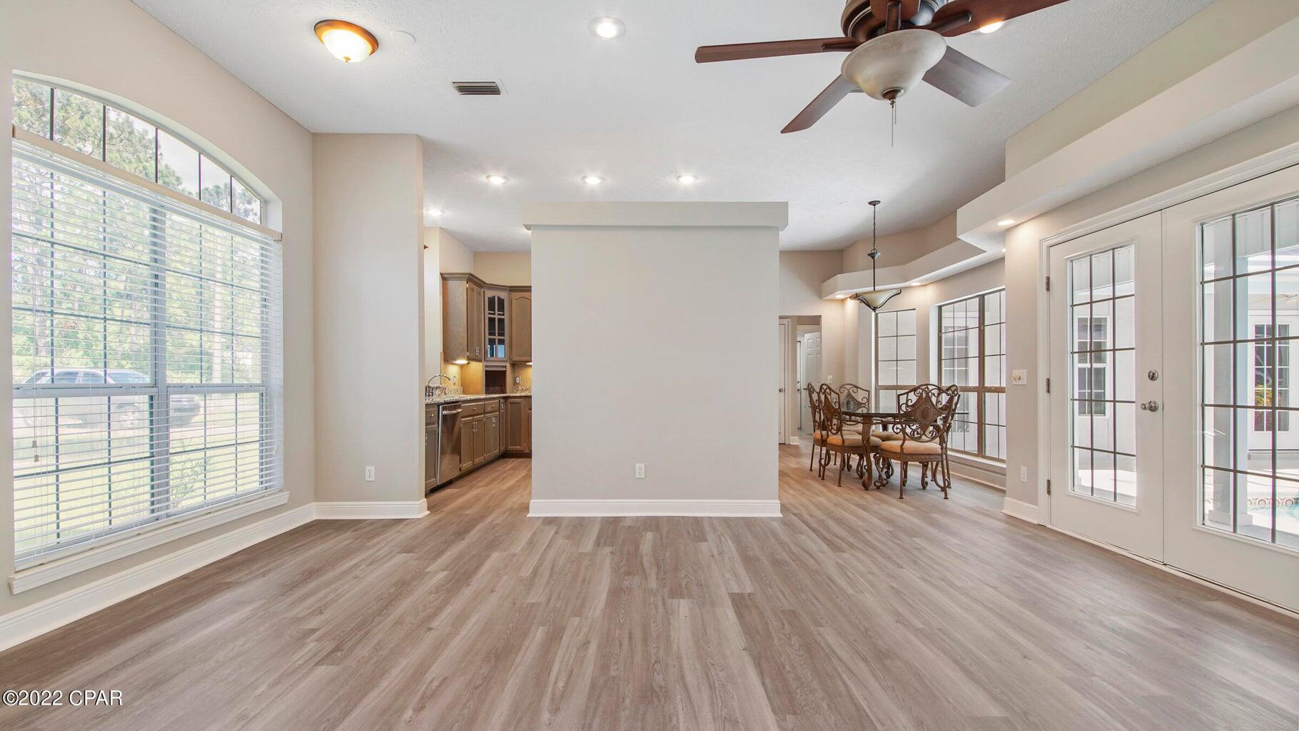 104 Colony Harbour Road Panama City Beach, FL 32407 - Photo 20 of 75 a view of a room with wooden floor and a window