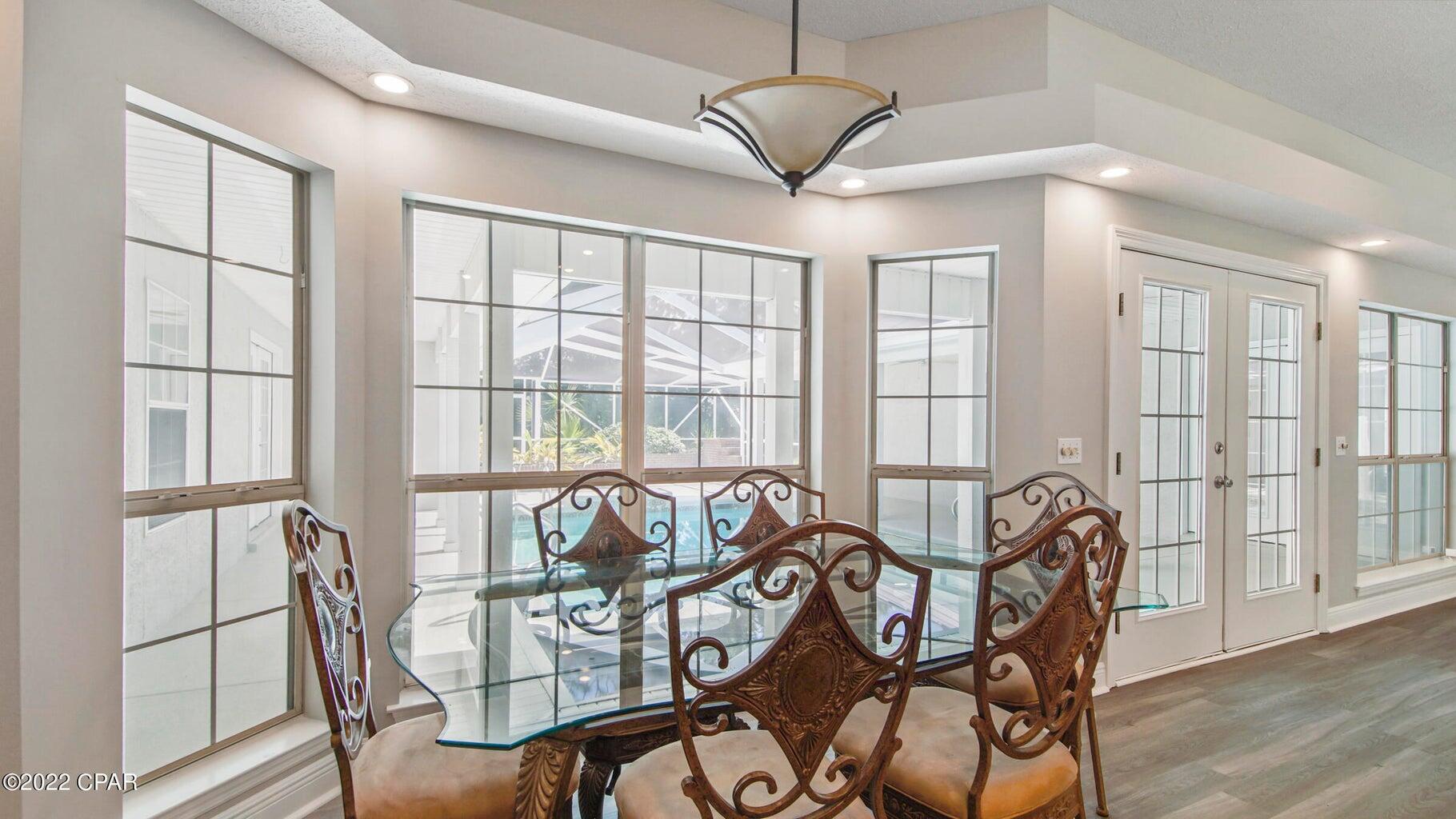 104 Colony Harbour Road Panama City Beach, FL 32407 - Photo 26 of 75 a view of a dining room with furniture window and outside view