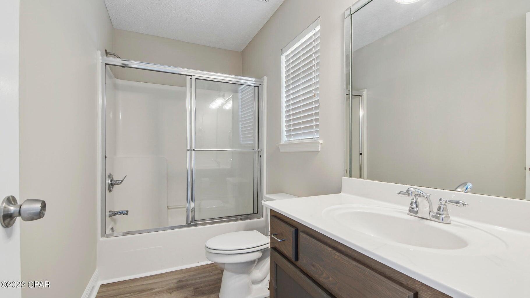 104 Colony Harbour Road Panama City Beach, FL 32407 - Photo 41 of 75 a bathroom with a sink toilet and shower