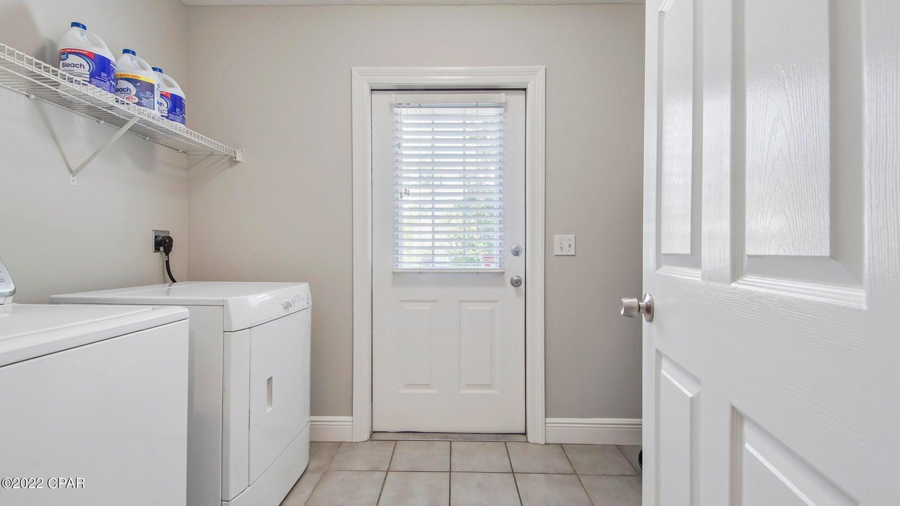 104 Colony Harbour Road Panama City Beach, FL 32407 - Photo 48 of 75 a view of storage and utility room with washer and dryer