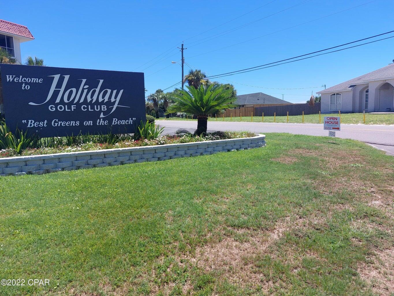 104 Colony Harbour Road Panama City Beach, FL 32407 - Photo 75 of 75 a view of a street with a building in the background