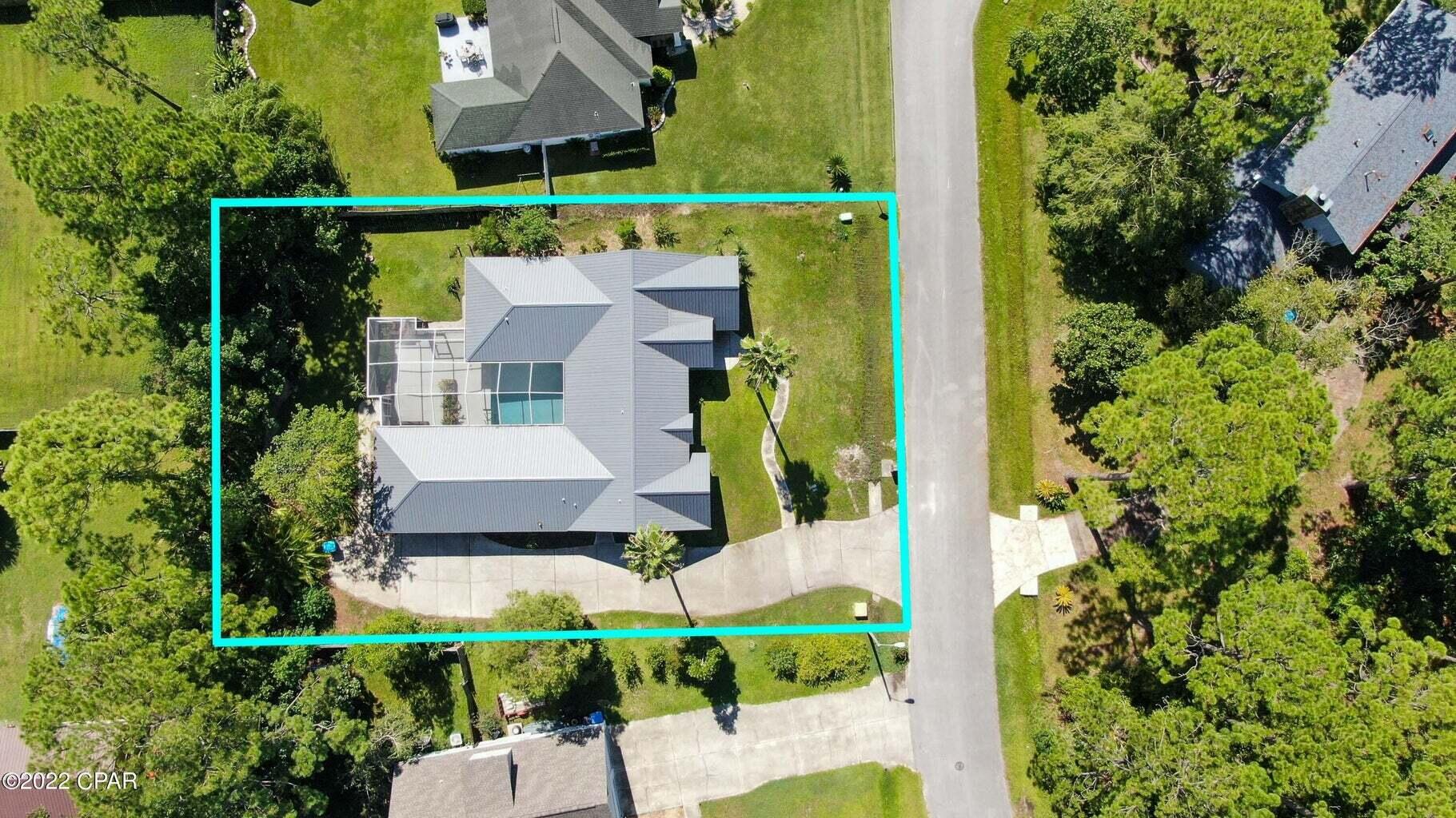 104 Colony Harbour Road Panama City Beach, FL 32407 - Photo 9 of 75 an aerial view of house with a yard and garden