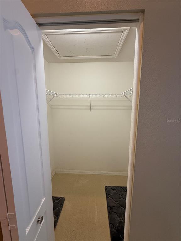 5320 Hyland Hills Avenue, Unit 2222 Sarasota, FL 34241 - Photo 14 of 29 a bathroom with a glass shower door