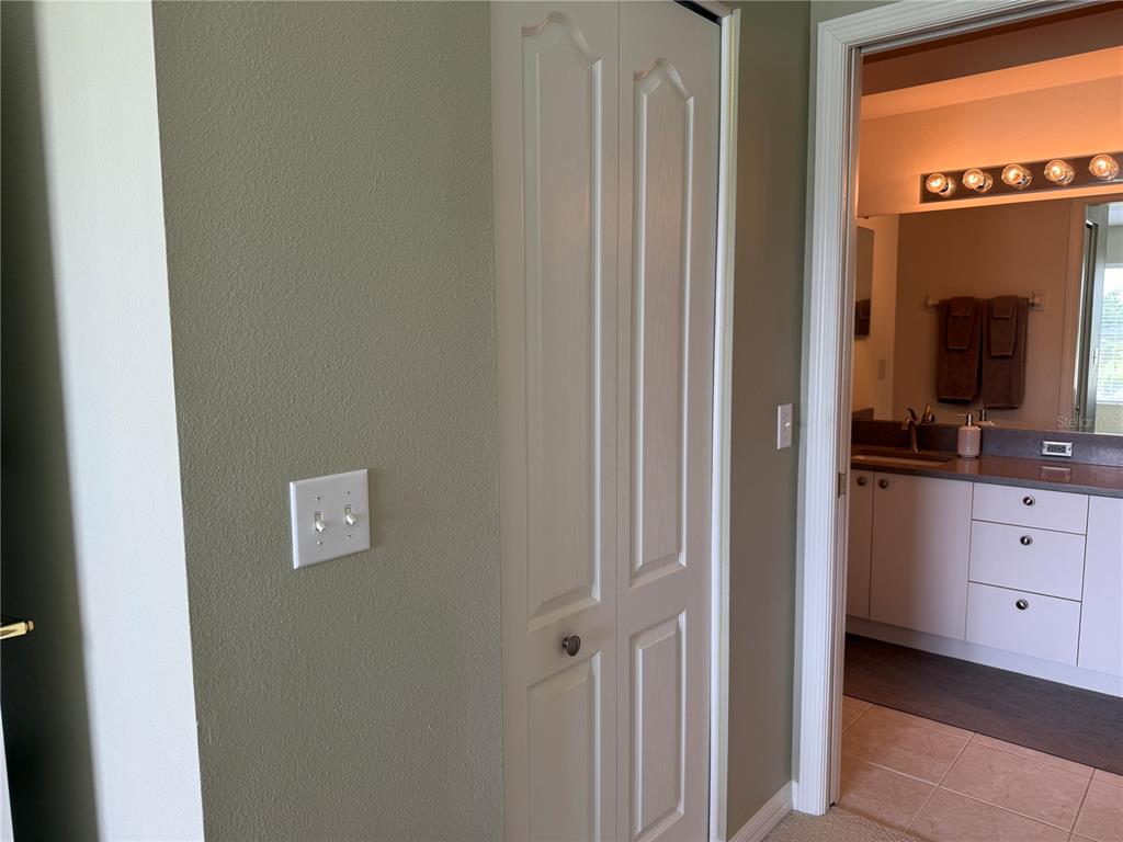 5320 Hyland Hills Avenue, Unit 2222 Sarasota, FL 34241 - Photo 18 of 29 a view of a bedroom from a hallway