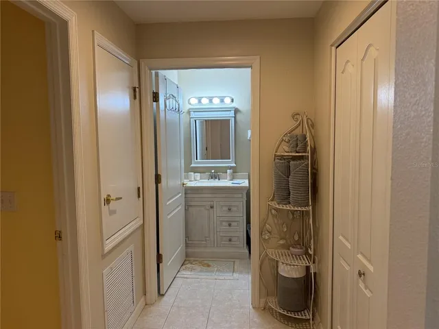 a bathroom with a shower and a sink