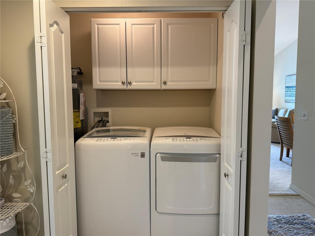 5320 Hyland Hills Avenue, Unit 2222 Sarasota, FL 34241 - Photo 25 of 29 a utility room with dryer and washer