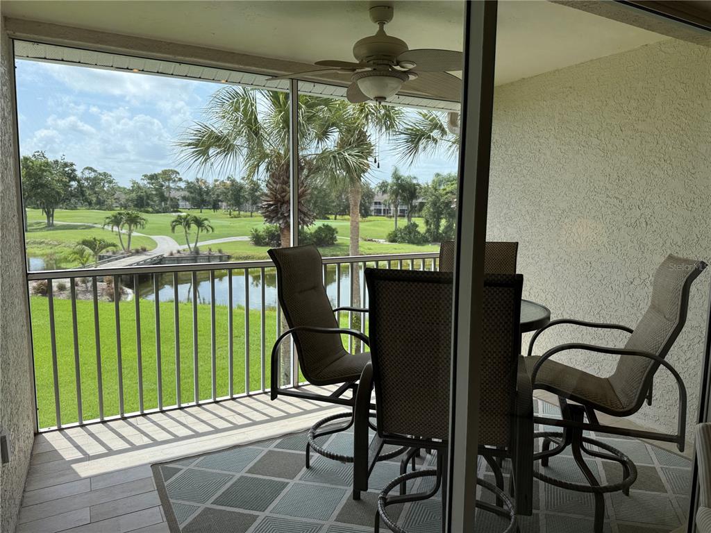 5320 Hyland Hills Avenue, Unit 2222 Sarasota, FL 34241 - Photo 26 of 29 a view of a balcony with chairs