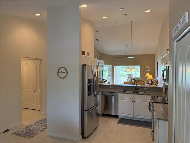 a kitchen with cabinets and window