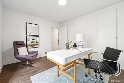 a view of a workspace with furniture