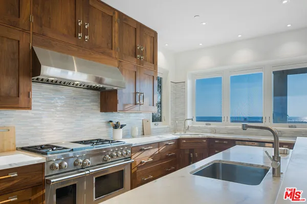 a view of swimming pool with outdoor seating and city view