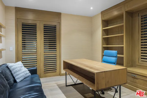 a bathroom with a granite countertop double vanity sink a mirror and a bathtub