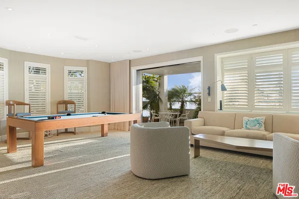 a bathroom with a sink mirror and a shower