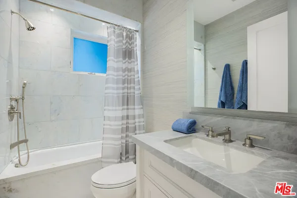 a living room with a couch and a fireplace