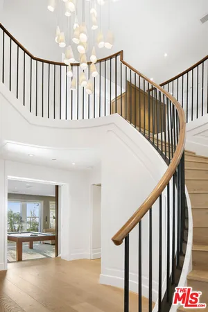 a view of a livingroom with furniture window and wooden floor