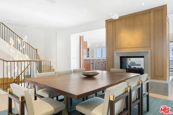 a kitchen with a sink window and cabinets
