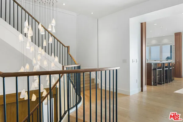 a kitchen with stainless steel appliances granite countertop a sink and a stove