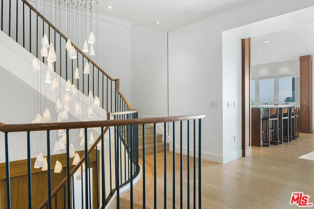 a kitchen with stainless steel appliances granite countertop a sink and a stove