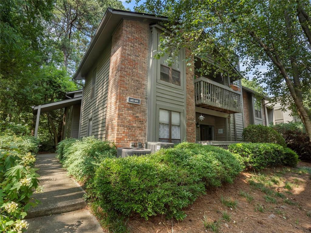 604 Tuxworth Circle Decatur, GA 30033 - Photo 1 of 1 a view of a house with brick walls and potted plants