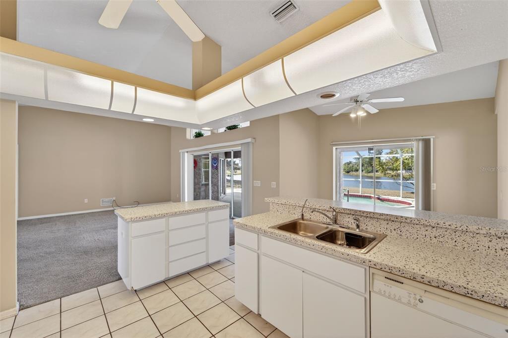 4541 Blueridge Street North Port, FL 34287 - Photo 12 of 52 a kitchen with a sink cabinets and window
