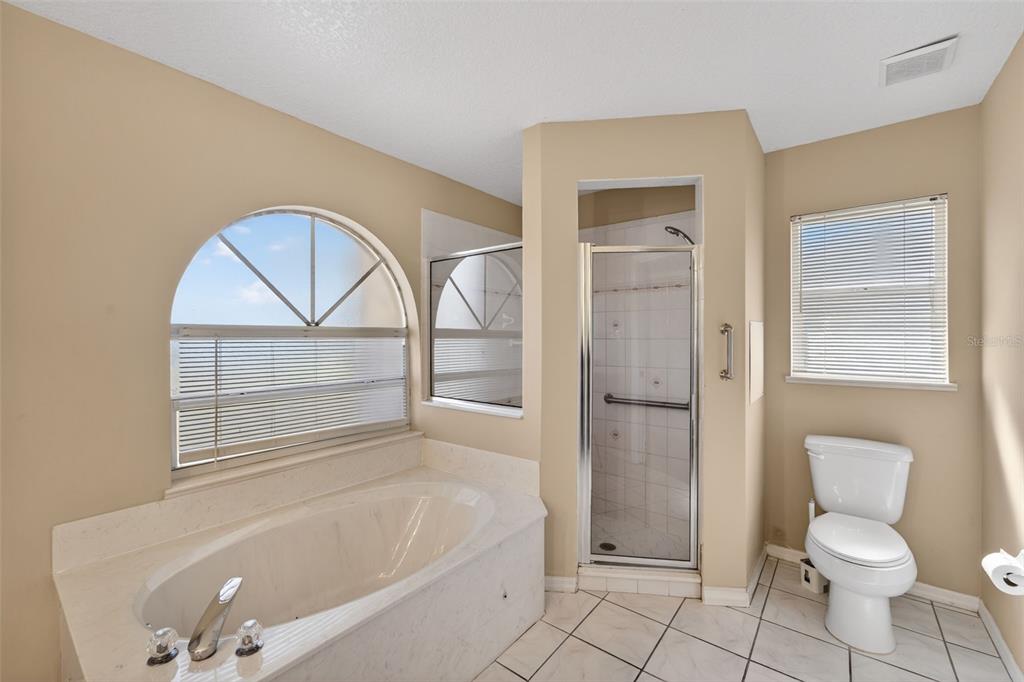 4541 Blueridge Street North Port, FL 34287 - Photo 29 of 52 a bathroom with a granite countertop toilet a sink and bathtub