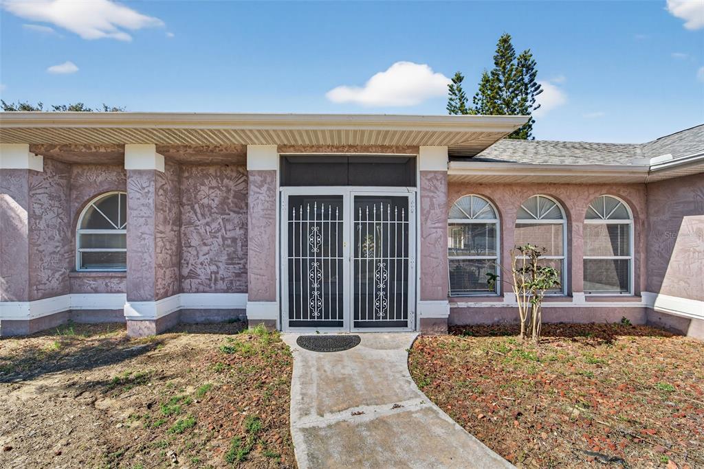 4541 Blueridge Street North Port, FL 34287 - Photo 3 of 52 a front view of a house