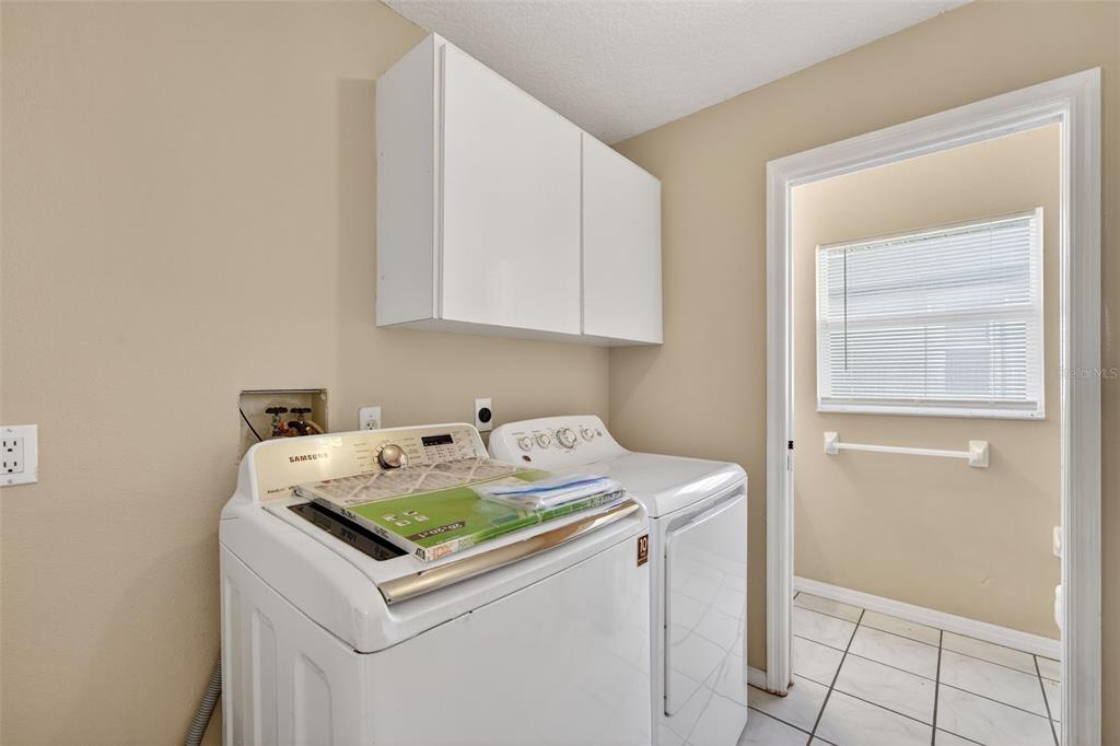 4541 Blueridge Street North Port, FL 34287 - Photo 32 of 52 a utility room with dryer and washer