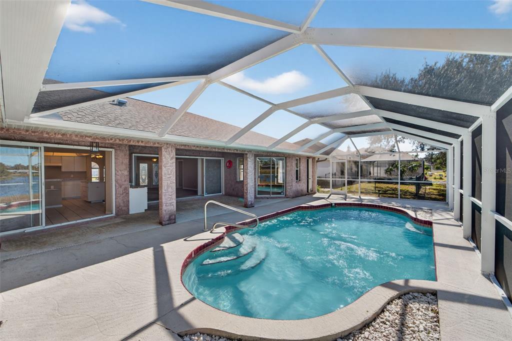 4541 Blueridge Street North Port, FL 34287 - Photo 37 of 52 a swimming pool with outdoor seating yard and barbeque oven