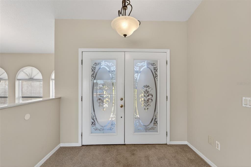 4541 Blueridge Street North Port, FL 34287 - Photo 4 of 52 a view of front door with chandelier