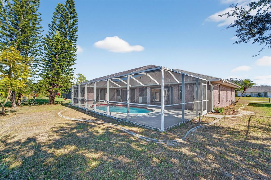 4541 Blueridge Street North Port, FL 34287 - Photo 41 of 52 a view of a house with backyard and sitting area