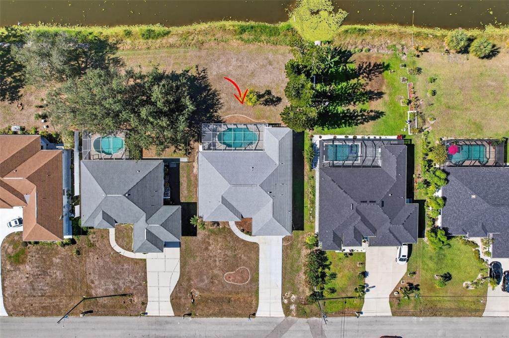 4541 Blueridge Street North Port, FL 34287 - Photo 43 of 52 an aerial view of a house with a yard and garden