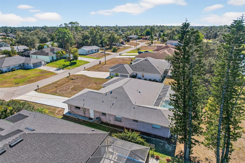 4541 Blueridge Street North Port, FL 34287 - Photo 51 of 52 an aerial view of a house with a swimming pool and lake view