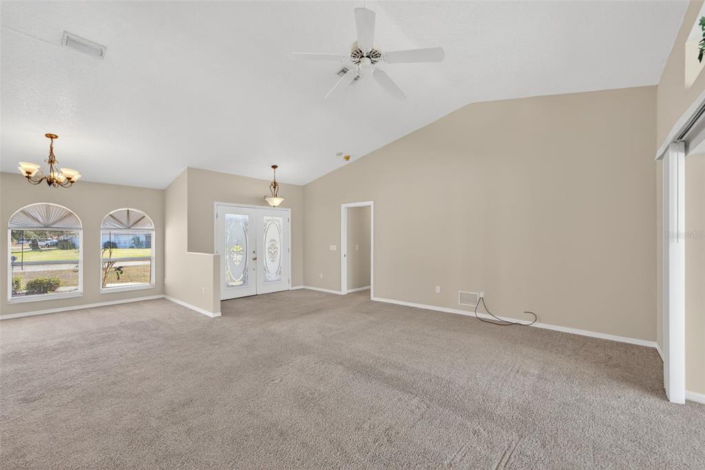 4541 Blueridge Street North Port, FL 34287 - Photo 6 of 52 an empty room with windows and fan