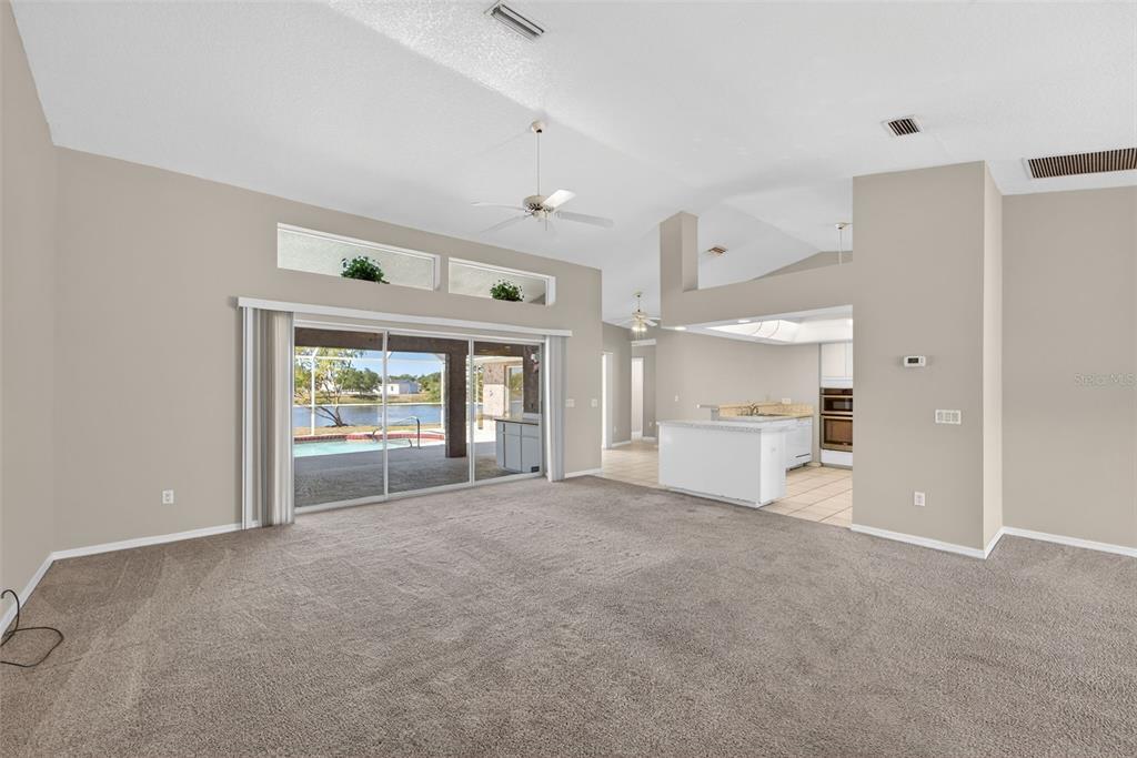 4541 Blueridge Street North Port, FL 34287 - Photo 8 of 52 a view of empty room with a fireplace and windows