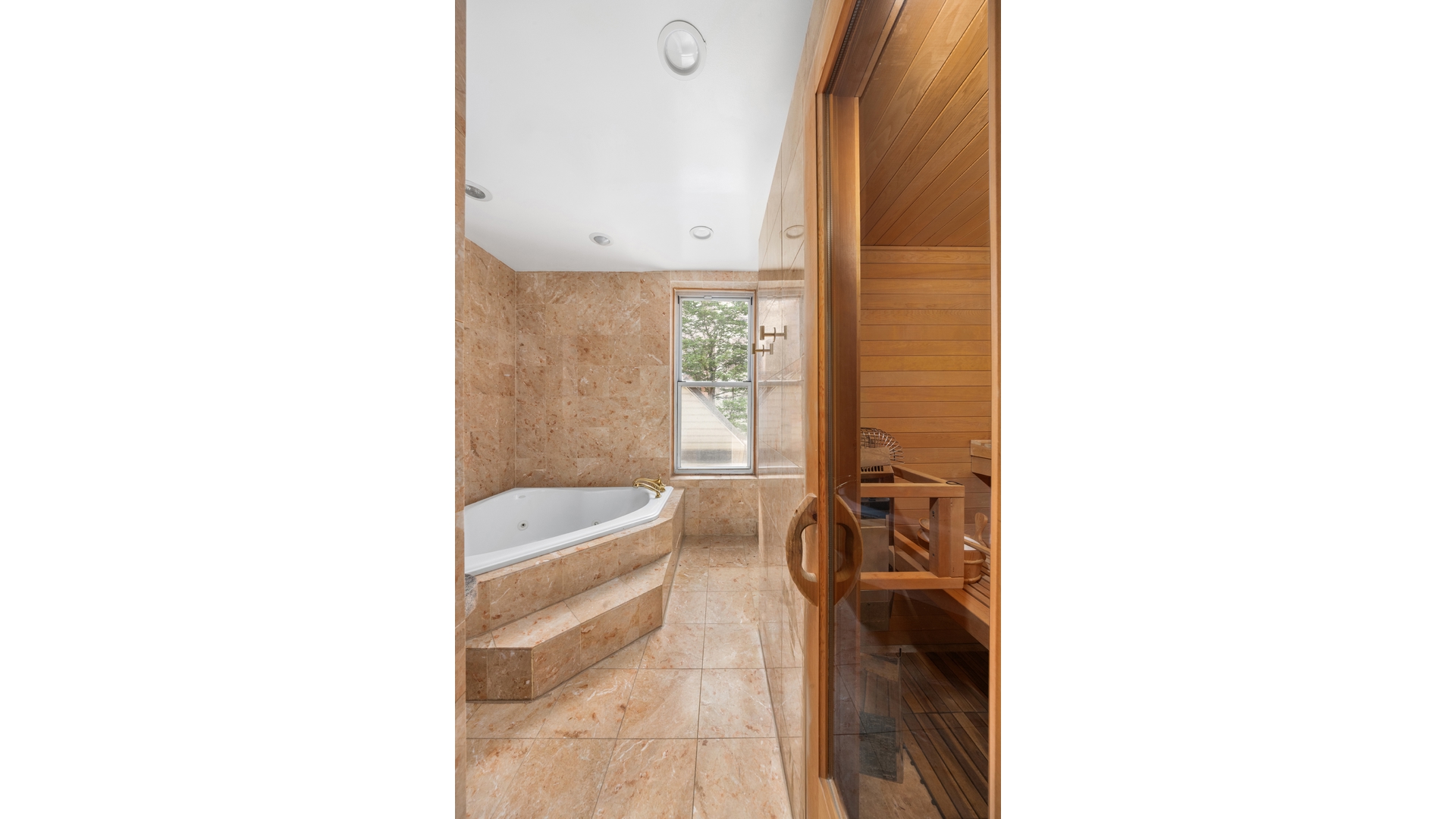 412 East 89th Street Manhattan, NY 10128 - Photo 13 of 25 a bathroom with a tub sink and mirror