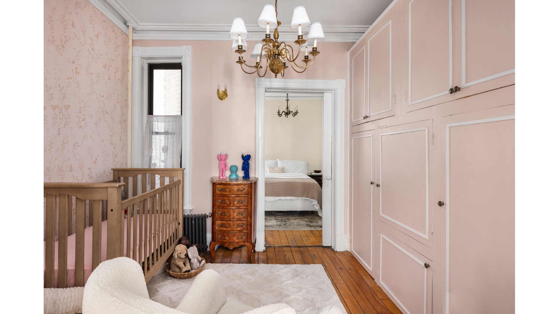 412 East 89th Street Manhattan, NY 10128 - Photo 14 of 25 a view of a bedroom with wooden floor
