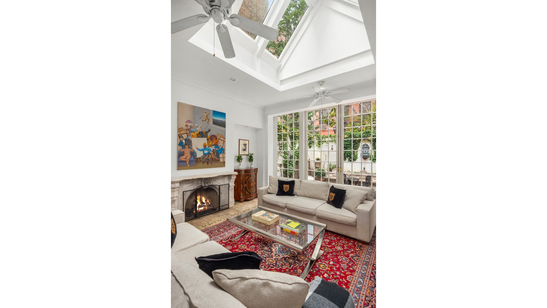 412 East 89th Street Manhattan, NY 10128 - Photo 3 of 25 a living room with furniture and a fireplace