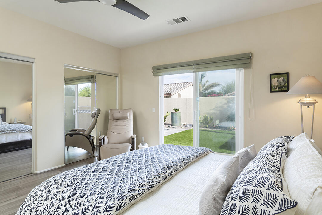 1280 Oro Ridge Palm Springs, CA 92262 - Photo 23 of 46 a bedroom with a bed and window