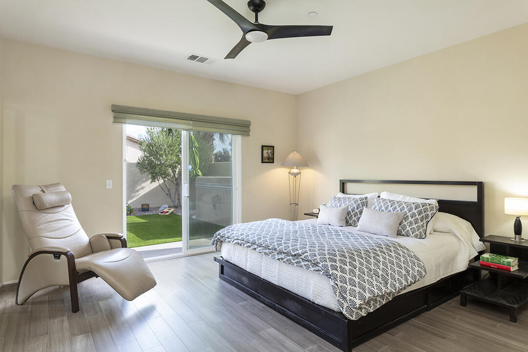 1280 Oro Ridge Palm Springs, CA 92262 - Photo 24 of 46 a bedroom with a bed and a view of couch