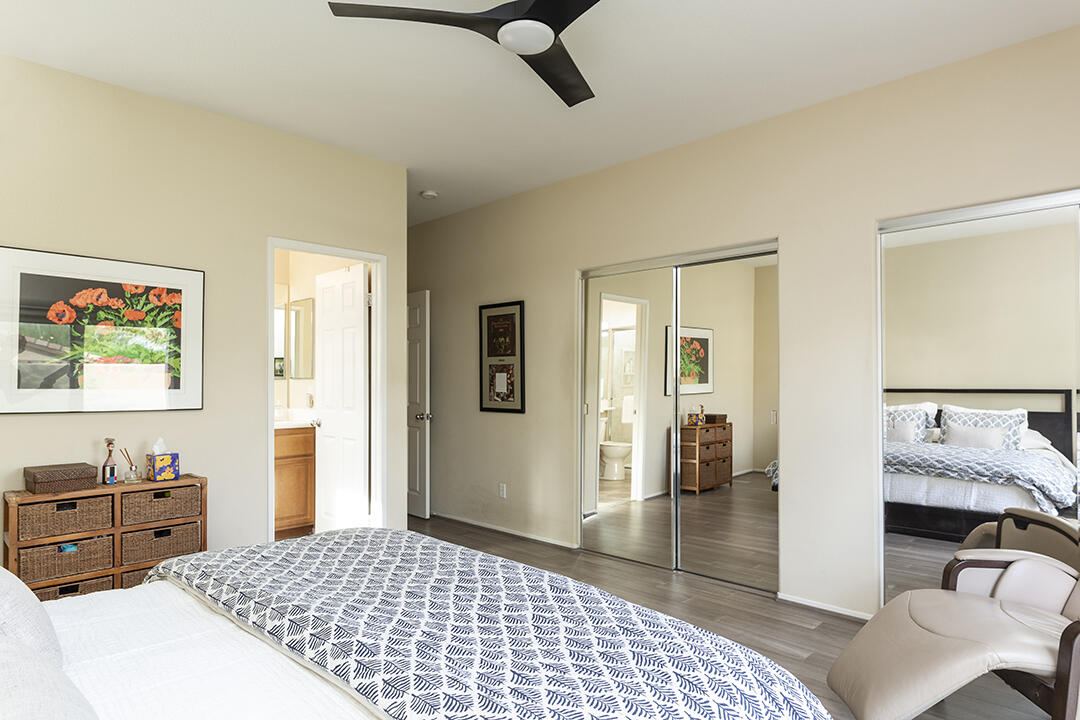 1280 Oro Ridge Palm Springs, CA 92262 - Photo 26 of 46 a bedroom with a bed and wooden floor