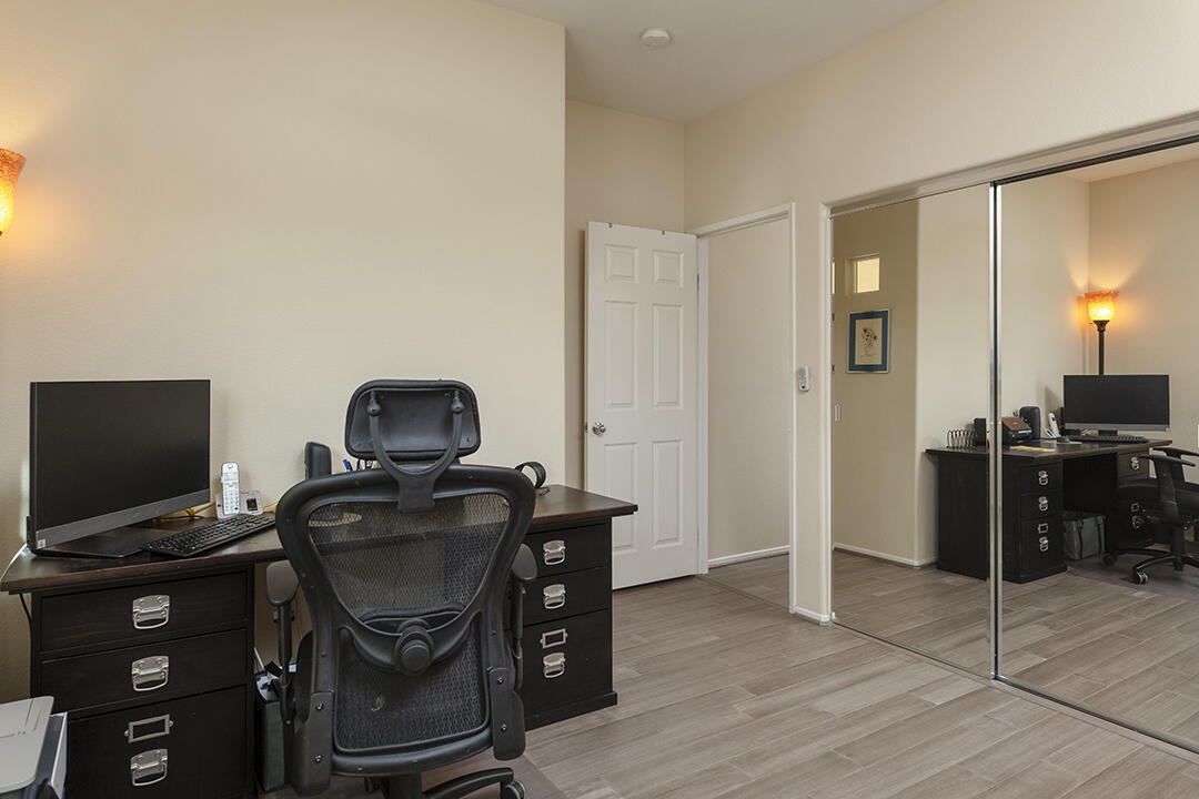 1280 Oro Ridge Palm Springs, CA 92262 - Photo 30 of 46 a view of a workspace with furniture and a flat screen tv