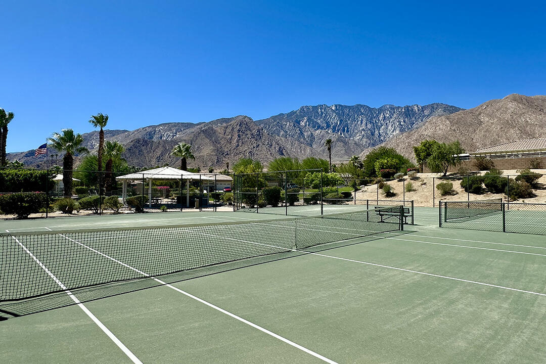 1280 Oro Ridge Palm Springs, CA 92262 - Photo 40 of 46 a view of a tennis ground with large trees