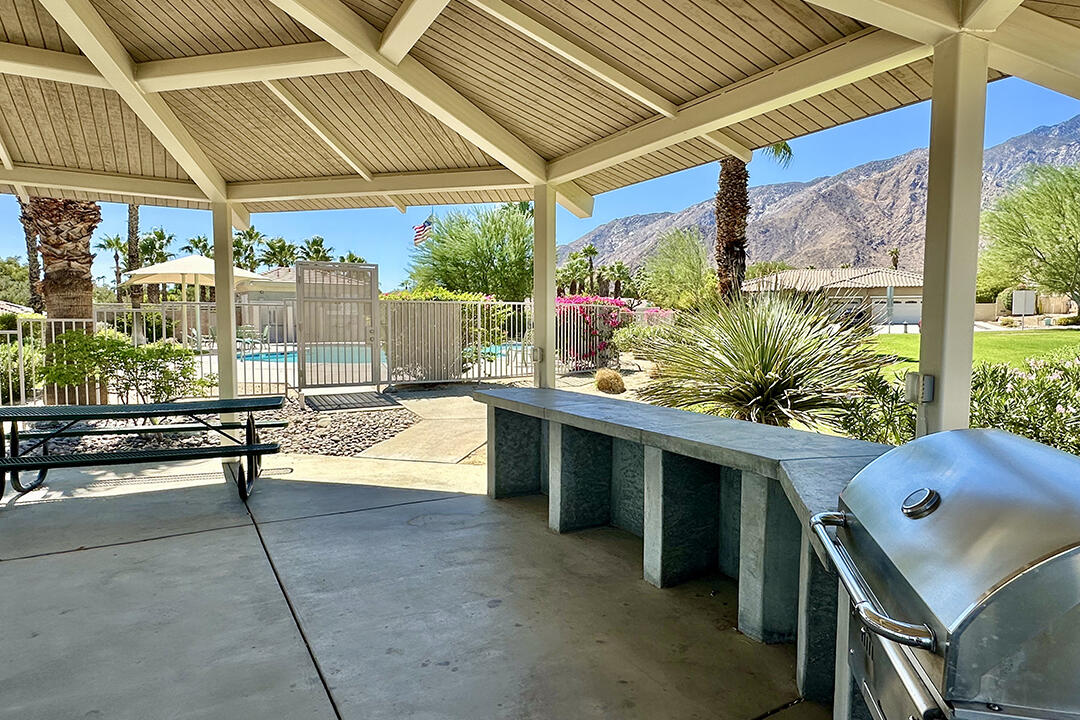 1280 Oro Ridge Palm Springs, CA 92262 - Photo 42 of 46 a building outdoor space with patio furniture and potted plants