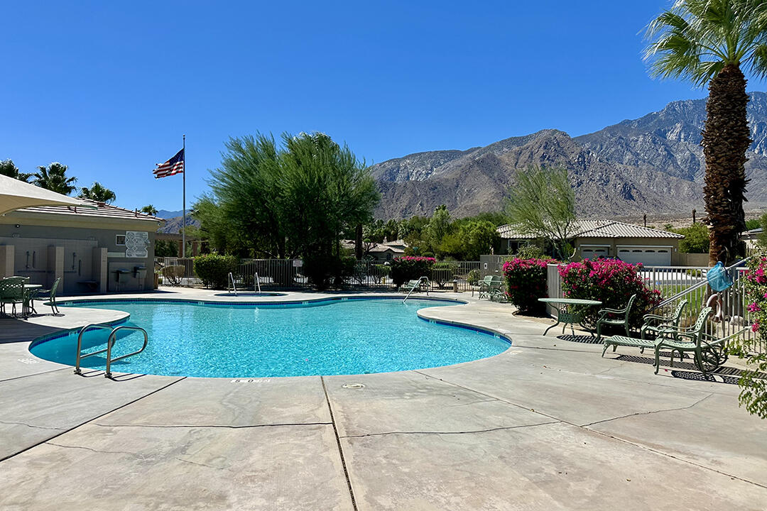 1280 Oro Ridge Palm Springs, CA 92262 - Photo 43 of 46 a view of swimming pool with outdoor seating and a garden
