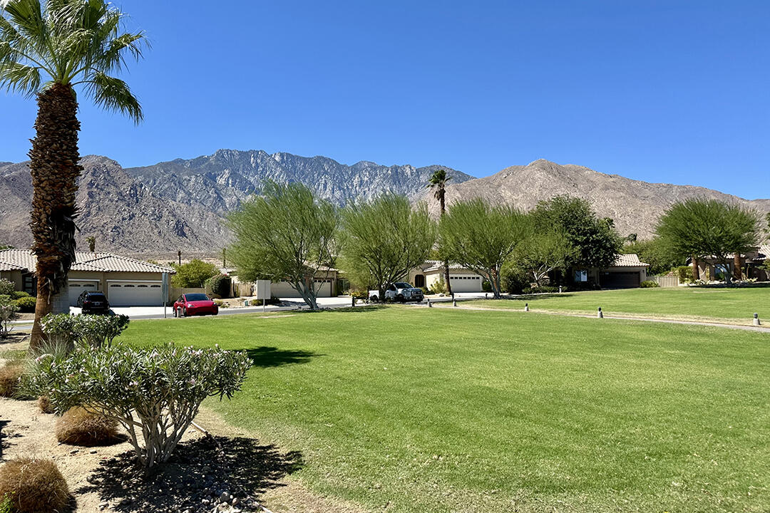 1280 Oro Ridge Palm Springs, CA 92262 - Photo 44 of 46 a view of a grassy field with mountains in the background