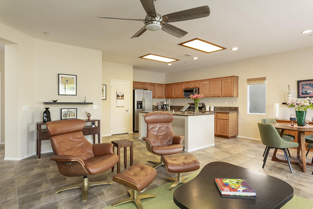 1280 Oro Ridge Palm Springs, CA 92262 - Photo 8 of 46 a living room with furniture kitchen view and a chandelier
