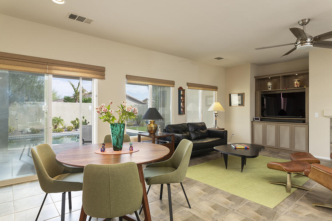 1280 Oro Ridge Palm Springs, CA 92262 - Photo 10 of 46 a living room with furniture a flat screen tv and a large window