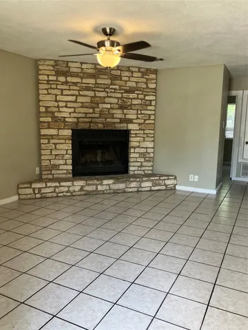 a view of fireplace with wooden floor