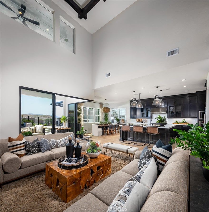 27534 Elderberry Drive Valencia, CA 91381 - Photo 3 of 17 a living room with furniture kitchen view and a large window